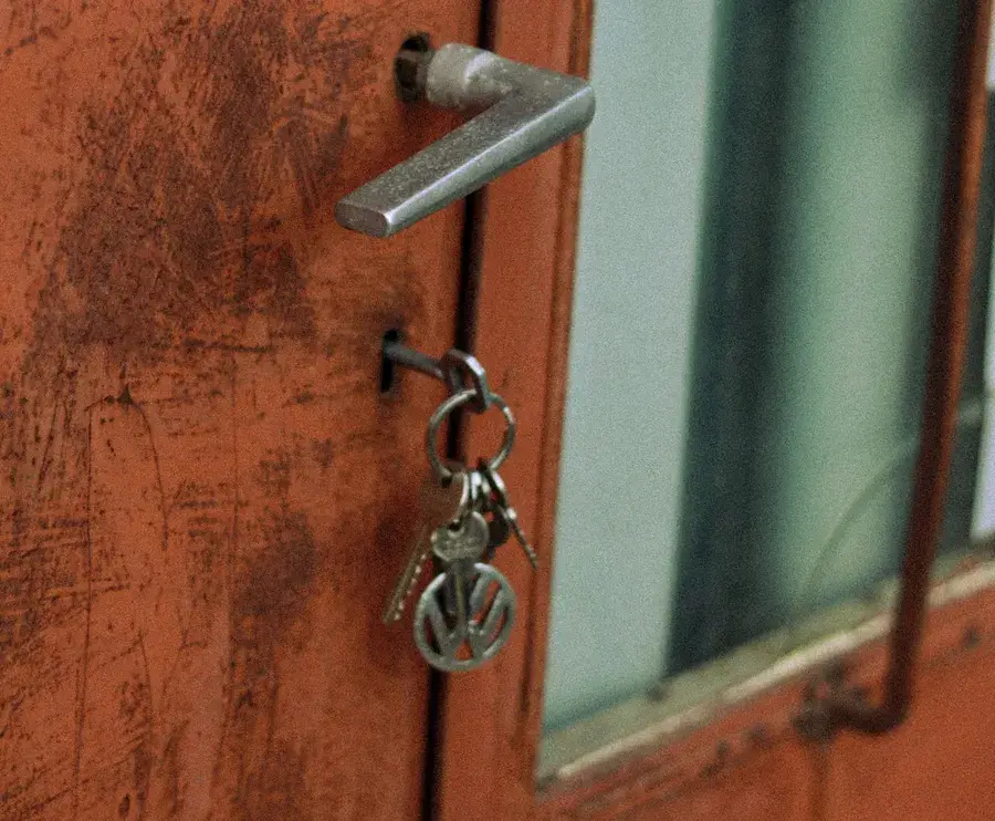Keys hanging from the lock of an old door – why keys snap and when broken key removal Lancing is needed, Locksmith Lancing